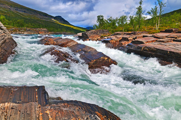 The rough mountain river Kaytum in national park Sarek in Sweden - 118398698