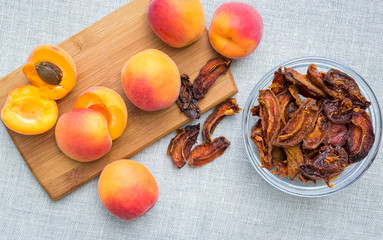 Bowl full of home made sun dried and fresh apricots, top view