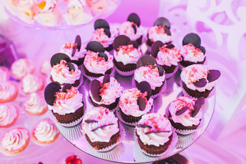 Candy bar, chocolate cupcakes on the mirror, baked goods