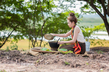 Naklejka na ściany i meble Asian woman are cooking in countryside.