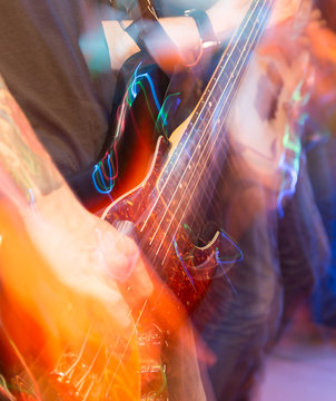 aggressive play guitar on stage