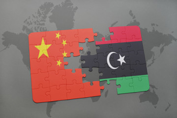 puzzle with the national flag of china and libya on a world map background.