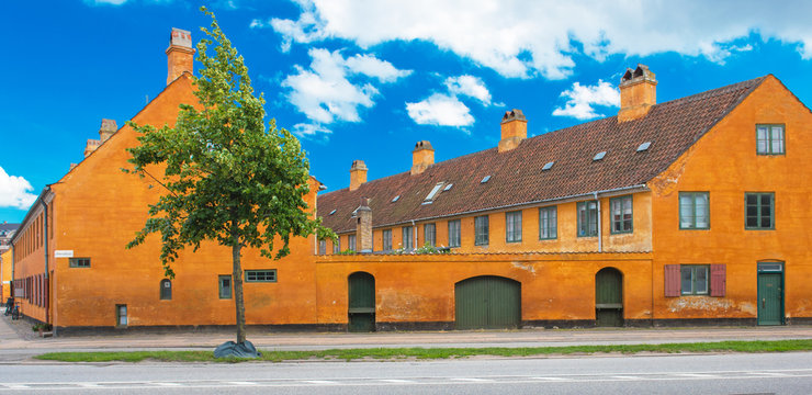 Nice old yellow houses of Nyboder, medieval district of Copenhagen, Denmark
