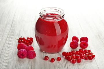 Fresh berry cocktail on wooden background