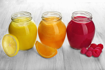 Fruit and berry cocktails on wooden background