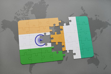 puzzle with the national flag of india and cote divoire on a world map background.