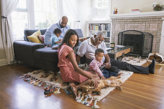 African American family relaxing in living room