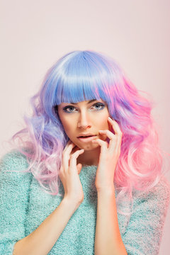 Gorgeous young woman with pastel blue and pink hair