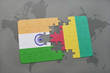 puzzle with the national flag of india and guinea on a world map background.