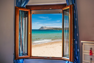 beach seen through an open window