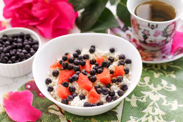 Healthy breakfast cottage cheese with fresh berries and tea