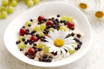 Healthy breakfast cottage cheese with fresh berries and tea
