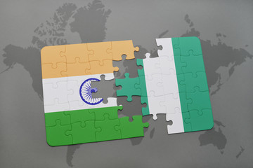 puzzle with the national flag of india and nigeria on a world map background.