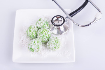 Malaysian Kuih pastry, Onde-Onde or Buah Melaka on white backgro