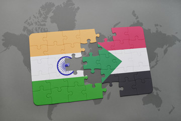 puzzle with the national flag of india and sudan on a world map background.