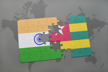 puzzle with the national flag of india and togo on a world map background.