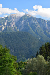 view of the Alps mountains peaks on the blue sky background