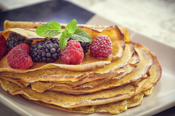 Pancake - Crepes with berries, mint and honey 