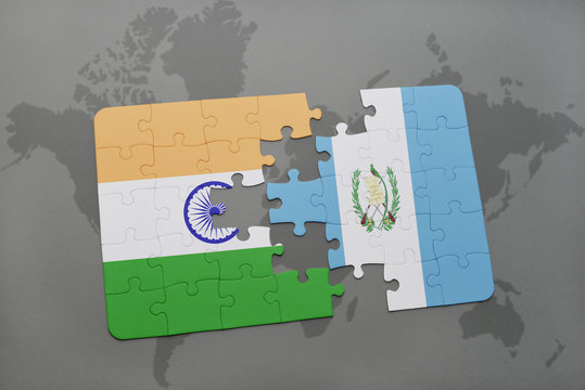 puzzle with the national flag of india and guatemala on a world map background.
