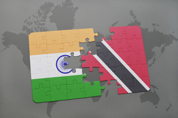 puzzle with the national flag of india and trinidad and tobago on a world map background.