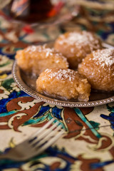 Turkish Dessert Kemalpasa on a Ottoman Pattern Surface.