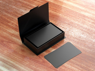 Black contact business cards in the open cardboard box. Clean mockup template with free copy space for design or advertising. On wooden texture table background. 3d illustration