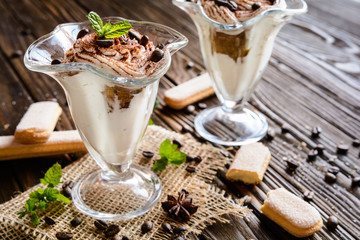 Traditional coffee Tiramisu dessert in glass jar