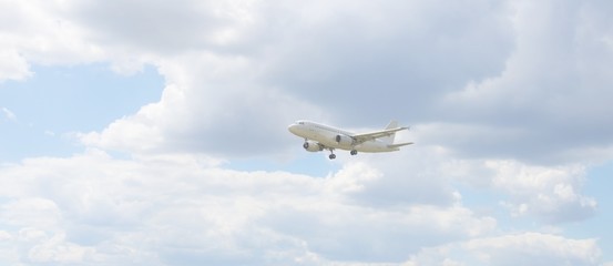 Airliner with landing gear takes off in the blue sky