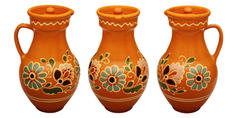Traditional colored pottery. Painted ceramic jugful.