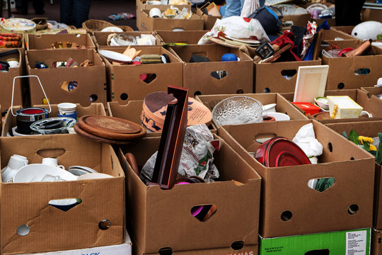 many cardboard boxes with used stuff for sale at the flea market