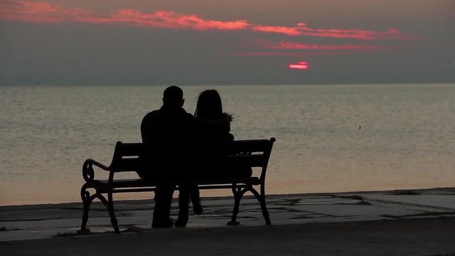 1920x1080 25 Fps. People near The Seaside Sitting and Looking Sea and Sunset landscape.
