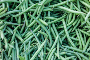 Closeup detail of organic green beans at an outdoor market in Seattle.
