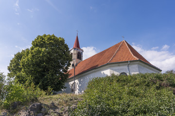 Fototapeta na wymiar Church with cemetery in Dubicky village