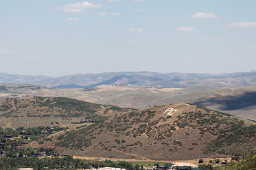 Fototapeta na wymiar PC for Park City, Utah in white letters on a hilltop