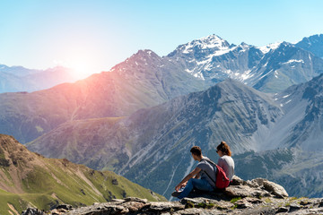 Naklejka premium Tourists watching the sunset
