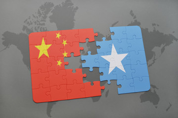 puzzle with the national flag of china and somalia on a world map background.