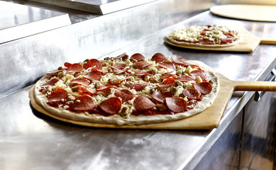 Uncooked Pizza on Stainless Steel Counter