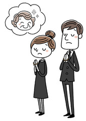 喪服を着た男女：合掌
