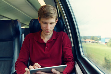 handsome man riding on a train