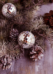 Christmas balls with fir branches and glasses of champagne
