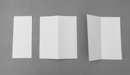 Bifold white template paper on gray  background .