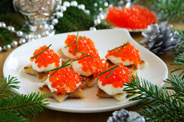 Canape with red caviar for the party, selective focus