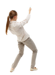 back view of standing girl pulling a rope from the top or cling to something. girl  watching. Rear view people collection.  backside view of person.  Isolated over white background. Skinny girl in