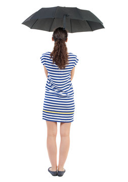 young woman in  dress under an umbrella. Rear view people collection.  backside view of person.  Isolated over white background. Swarthy girl in a checkered dress standing under an umbrella.