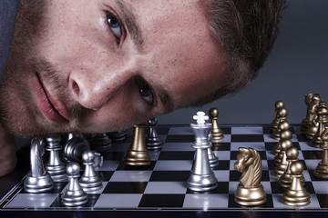 young man playing chess