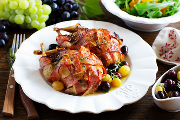 Baked stuffed quail with grape sauce.