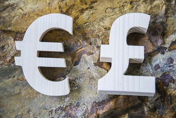 Exchange currency unit on a stone background
