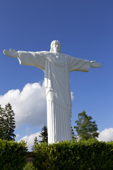 Big white Statue of Jesus over Landscape, Klin, Slovakia