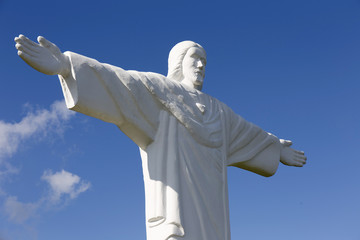 Big white Statue of Jesus over Landscape, Klin, Slovakia