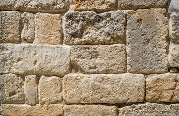 Traditional wall of stones built without lime. Dry stone wall.